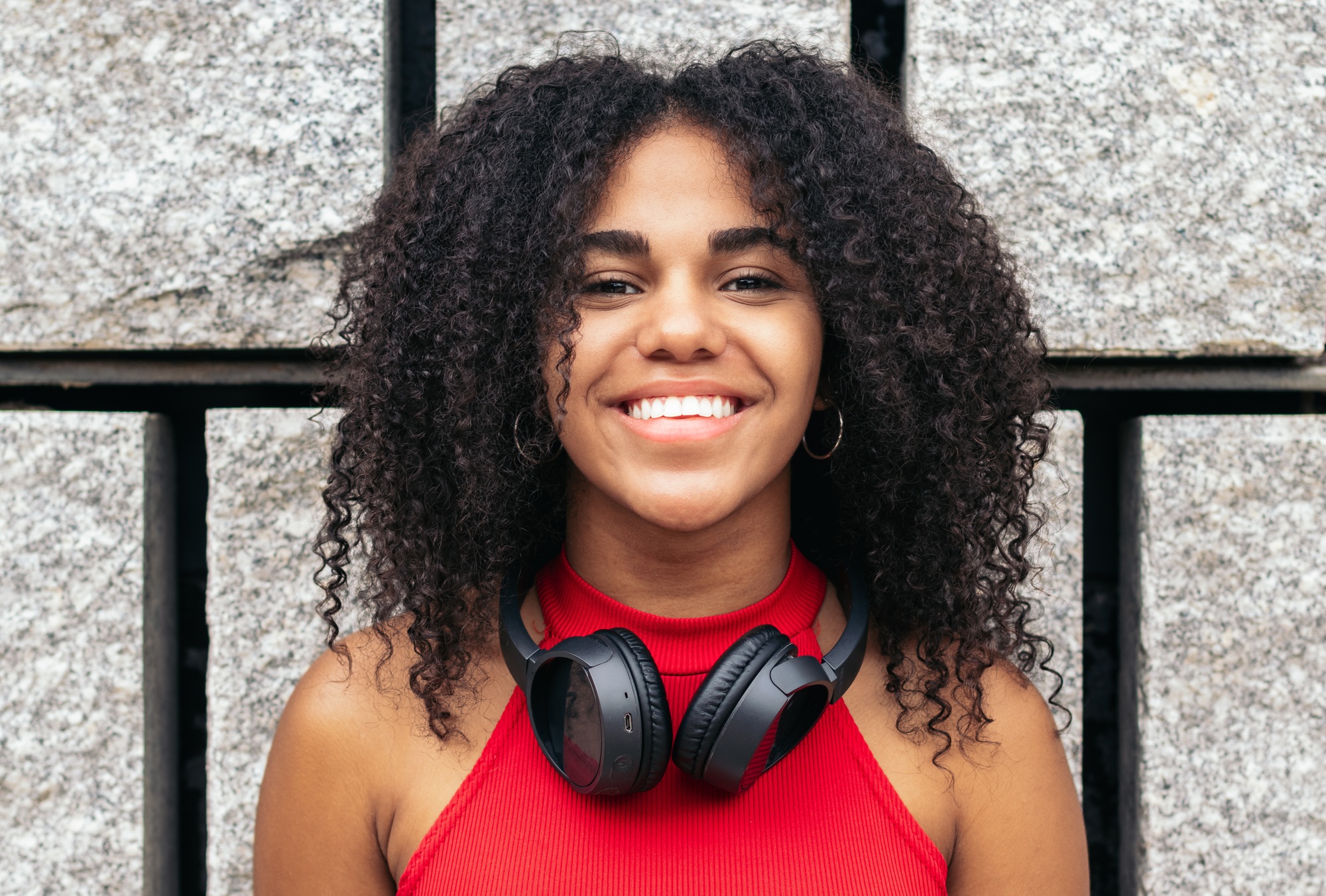 Portrait of a girl with afro hair enjoying in the city